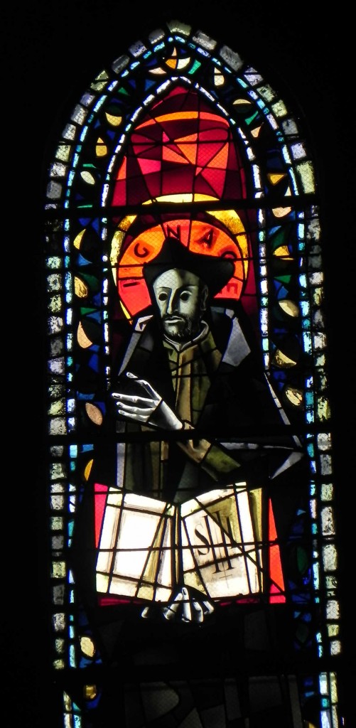 A stained glass window depicting St. Ignatius