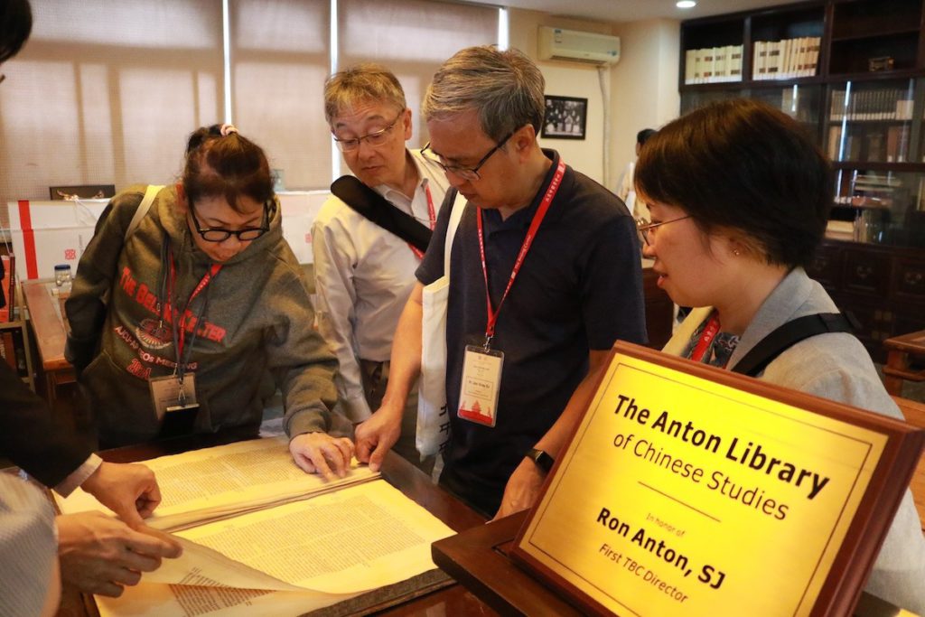 2024.09.JCAP-President-Fr-Primitivo-Viray-Jr.-SJ-and-other-meeting-participants-examining-the-collections-of-The-Beijing-Center