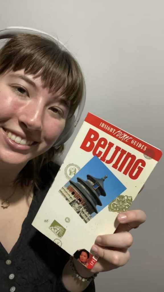 Ruby with her mother's book, Insight Pocket Guides Beijing