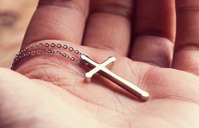 Faith-Christian-Hand-Cross-Palm_credit-Shutterstock