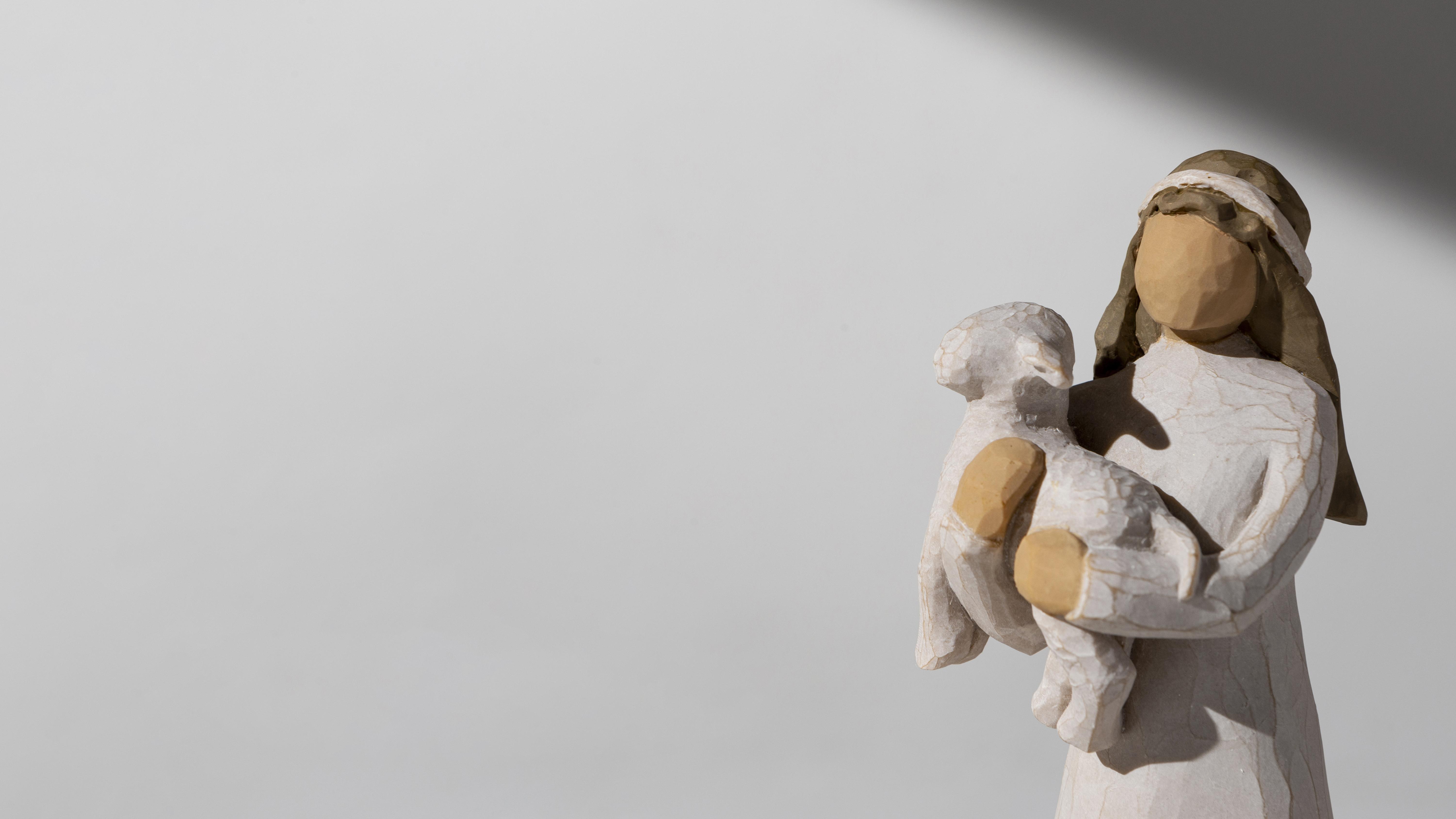 epiphany-day-female-figurine-with-sheep-snuggle.freepik